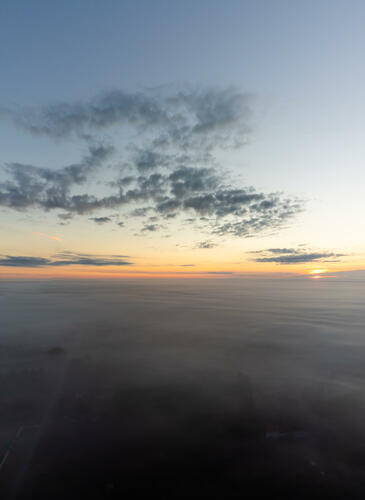 Sunrise above fog